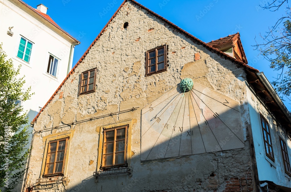 Sun dial on a facade of an old house in old town Zagreb, Croatia