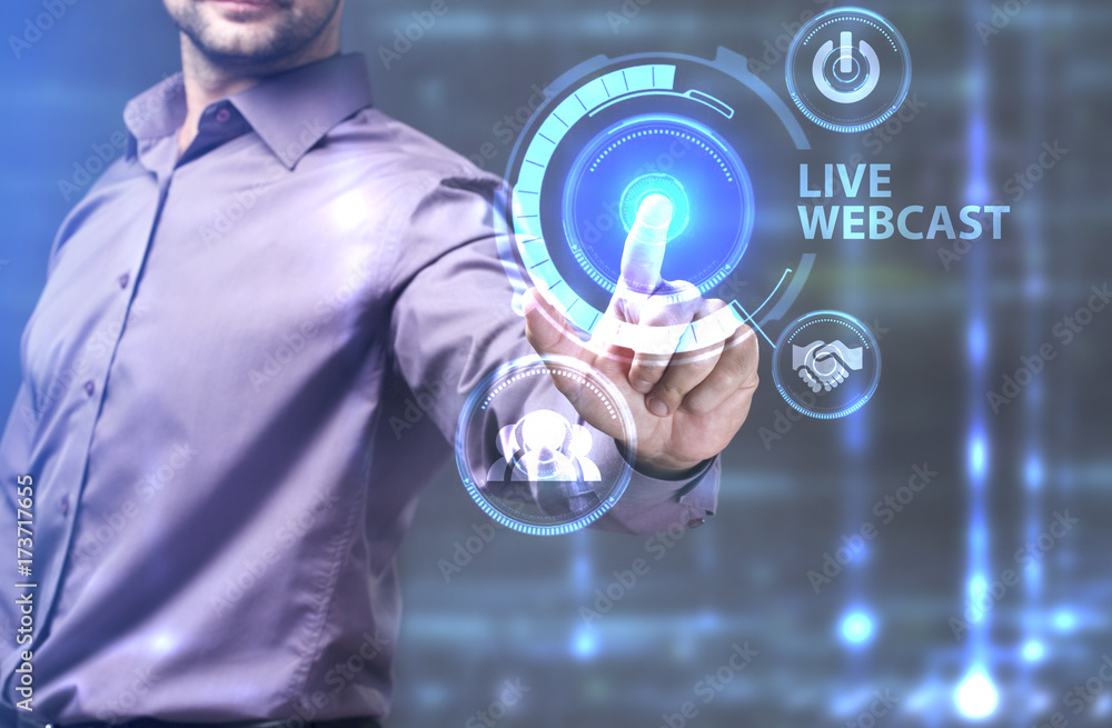 The concept of business, technology, the Internet and the network. A young entrepreneur working on a virtual screen of the future and sees the inscription: Live webcast The concept of business, technology, the Internet and the network. A young entrepreneur working on a virtual screen of the future and sees the inscription: Live webcast