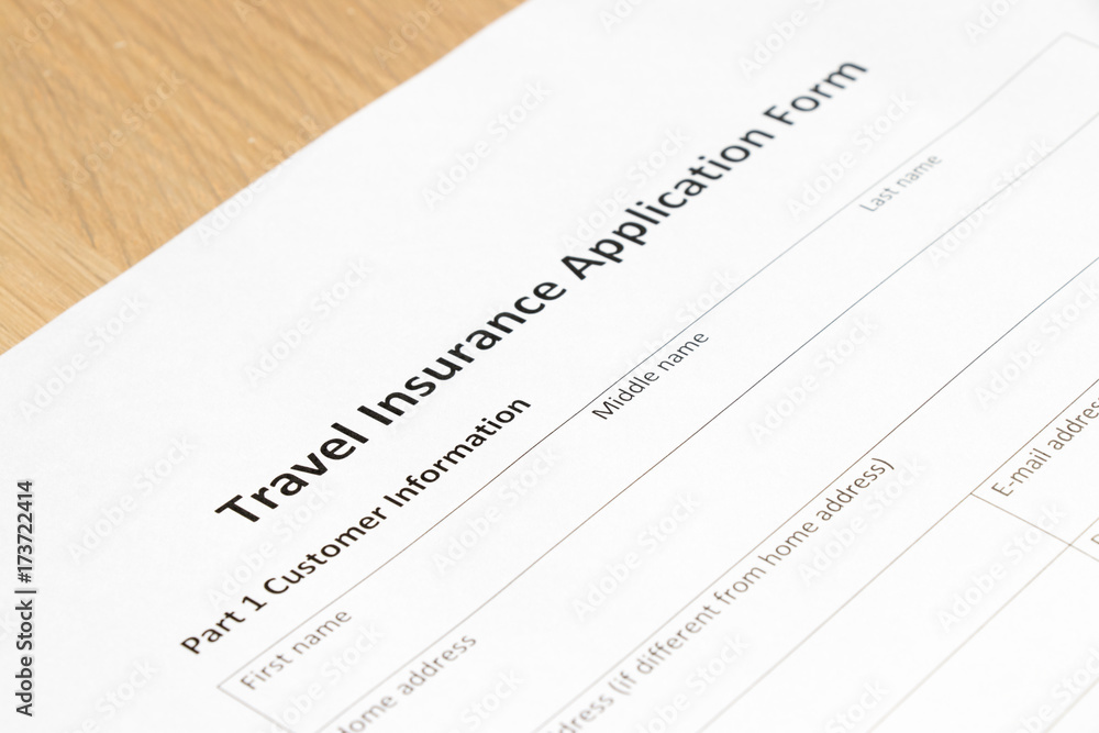 Travel insurance application form wait to fill information on desk background Travel insurance application form wait to fill information on desk background