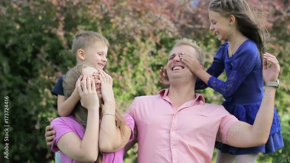 Young family having fun in nature. Concept of a friendly young family Young family having fun in nature. Concept of a friendly young family