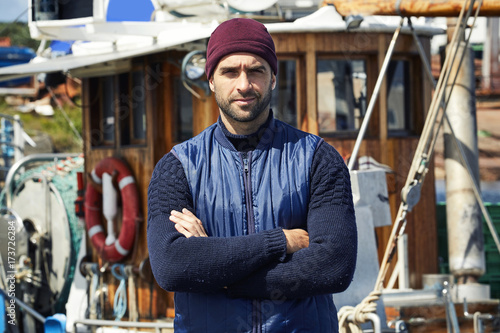 Serious fisherman fashion of knitwear and hat, portrait