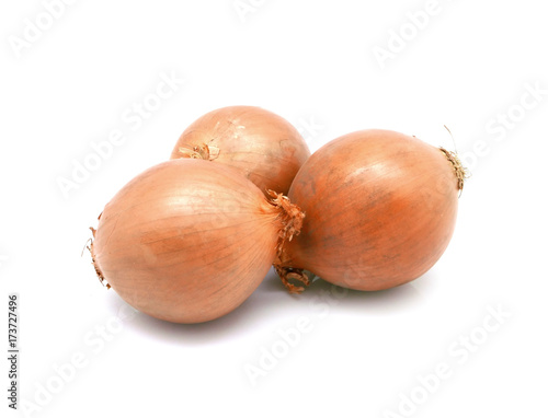 Isolated vegetable onion with skin on white background