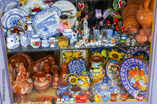 PORTO, PORTUGAL, on June 22, 2017. Traditional Portuguese souvenirs are exposed on a street show-window for involvement of buyers