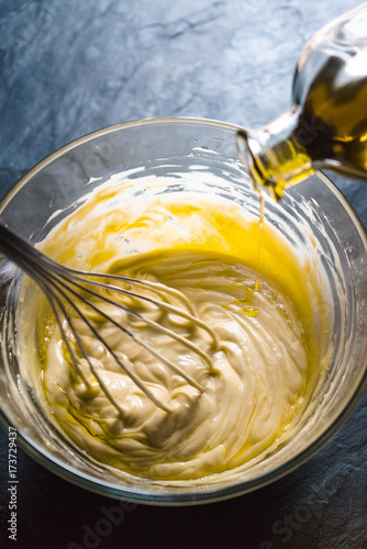 Beating of homemade mayonnaise with olive oil