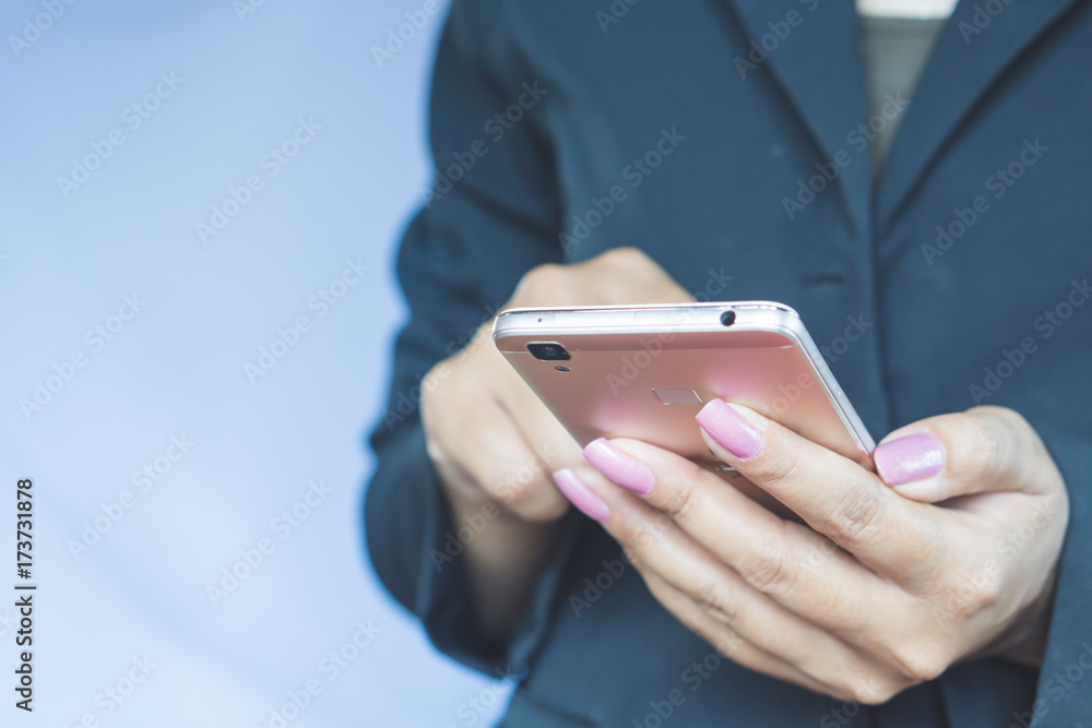 business woman hand holding mobile phone connecting to internet , people with social media and technology concept business woman hand holding mobile phone connecting to internet , people with social media and technology concept