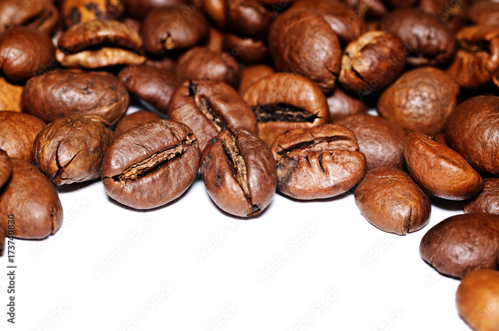 Fototapeta premium Coffee Grains fried on a white background. Macro