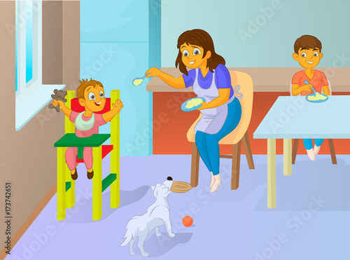 babysitter feeding baby in the kitchen