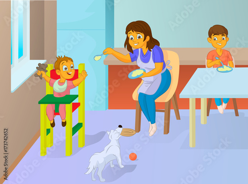 babysitter feeding baby in the kitchen