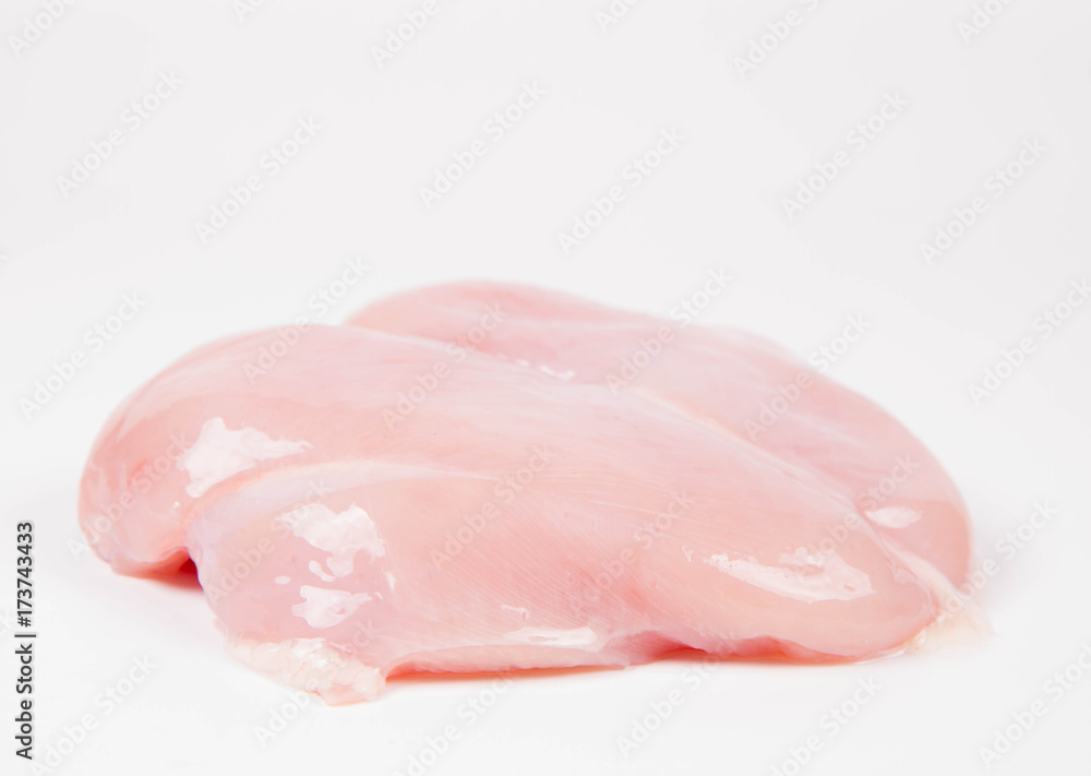Raw chicken breast on a white background Raw chicken breast on a white background