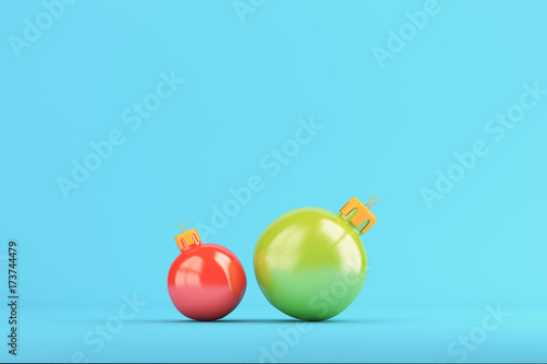 Two christmas balls on bright blue background