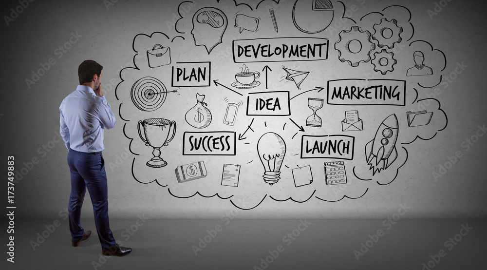 Businessman watching a project sketch on a wall 3D rendering Businessman watching a project sketch on a wall 3D rendering