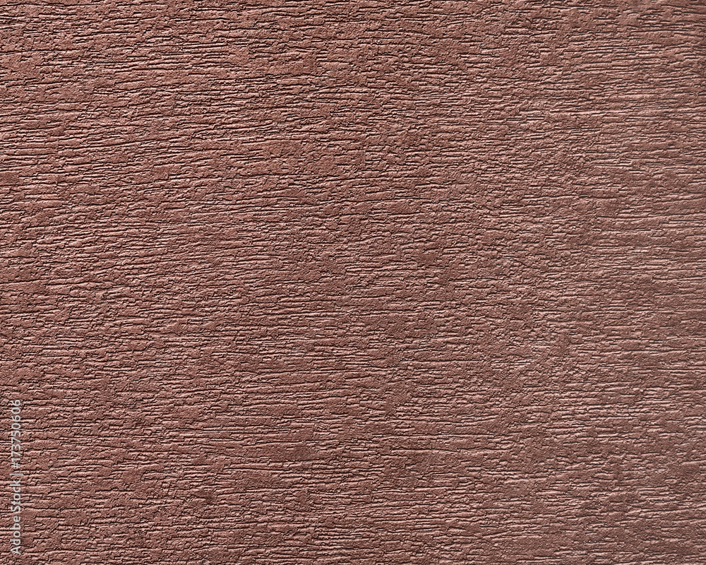 Fototapeta premium Painted facade wall. Building with structural vinous color paint
