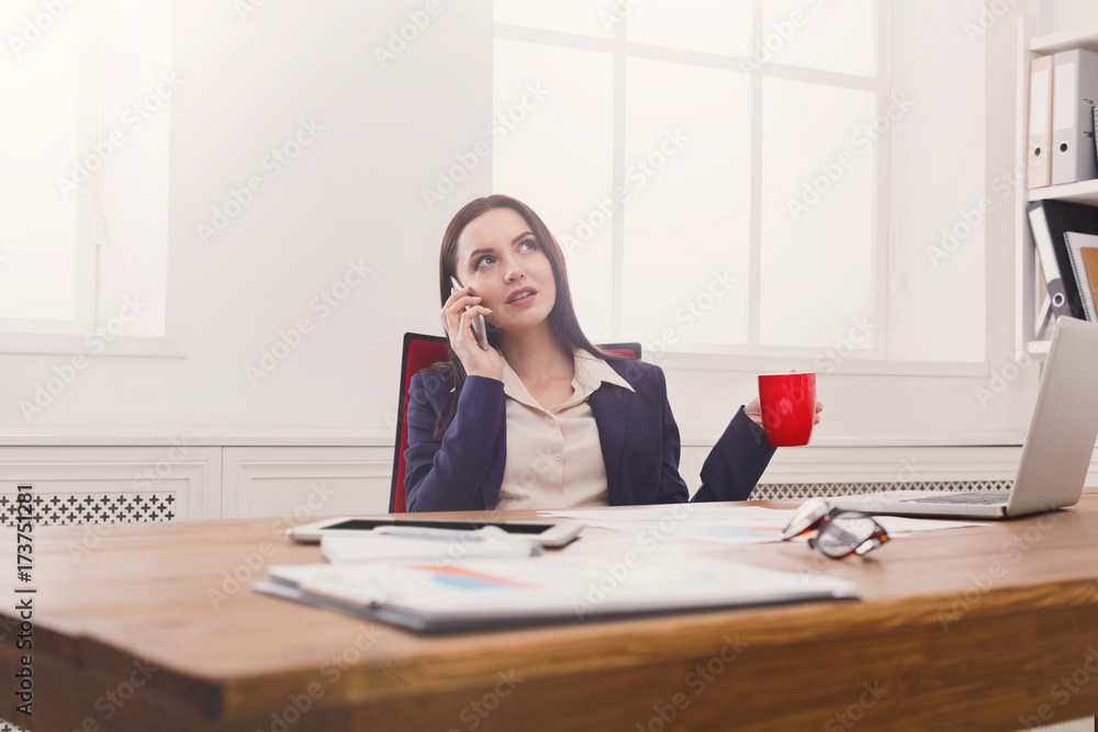Business talk, woman consulting by phone at office Business talk, woman consulting by phone at office