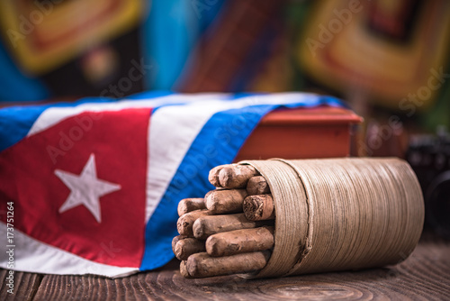 Photography Cuban cigar in ashtray on wooden table