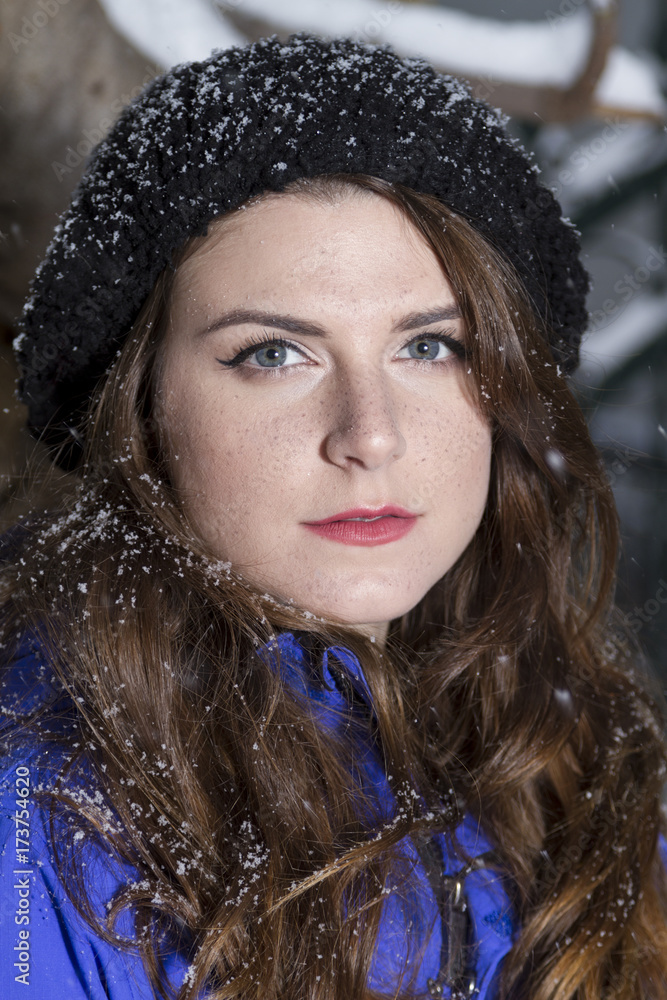 Beautiful winter portrait of young woman in the winter snowy scenery. Soft focus Beautiful winter portrait of young woman in the winter snowy scenery. Soft focus
