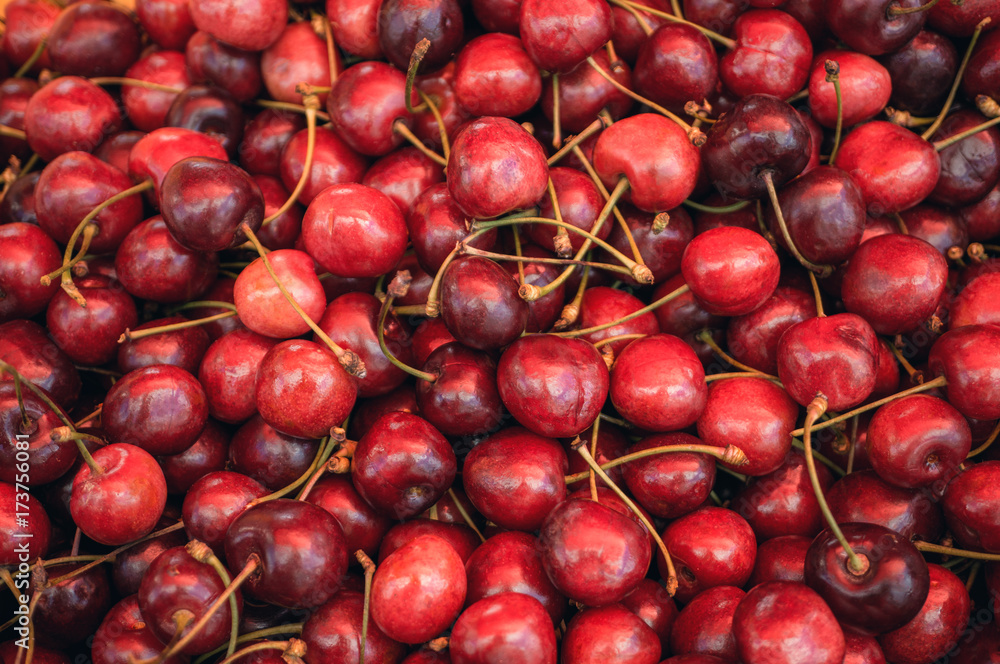 Background of ripe juicy cherries, which are sold at the farmers market. Background of ripe juicy cherries, which are sold at the farmers market.