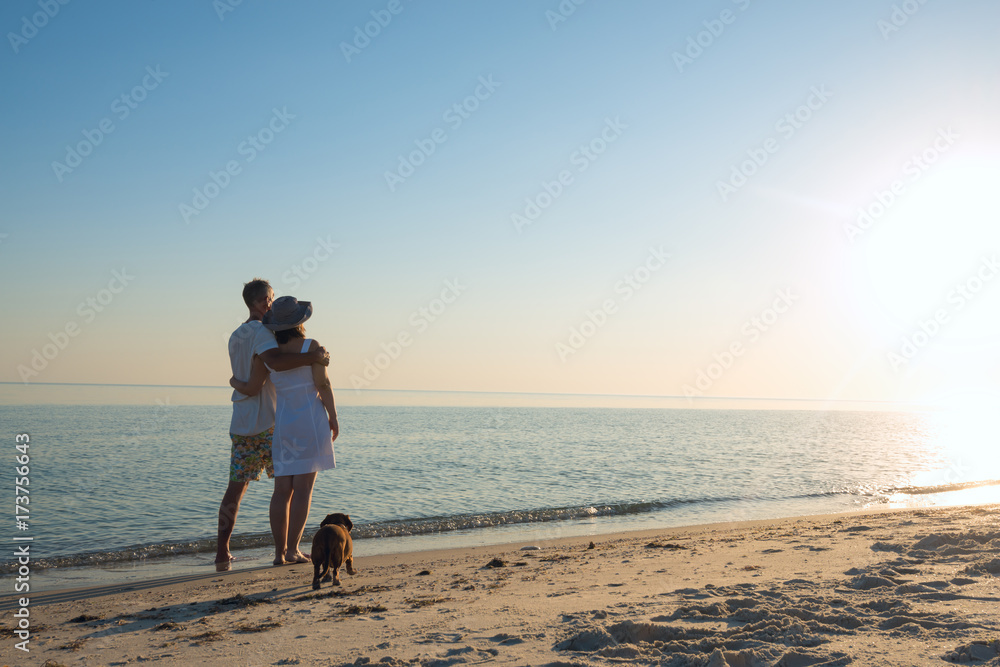 Romantic couple, with a little funny dog