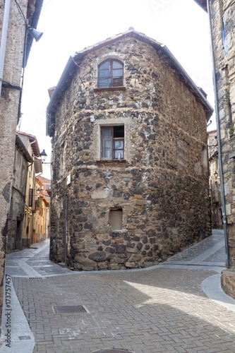 house in the middle of two streets in castellfullit de la roca, Spain photo