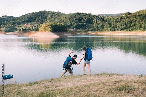 Hiking couple. Young couple having fun on their hiking trip 