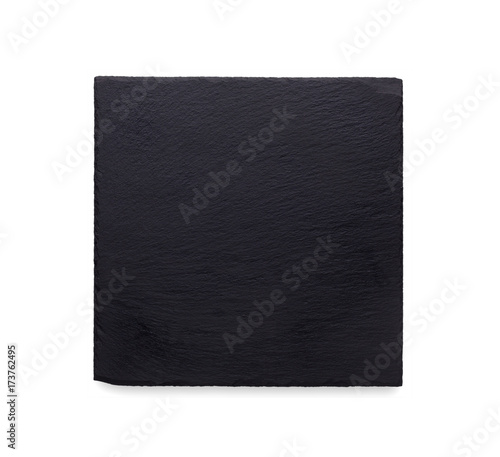 Empty rustic black slate stone plate isolated on white background