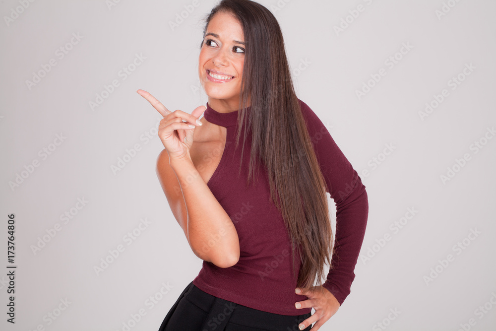positive woman points her finger and smiles III positive woman points her finger and smiles III