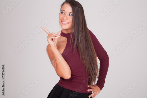 positive woman points her finger and smiles III