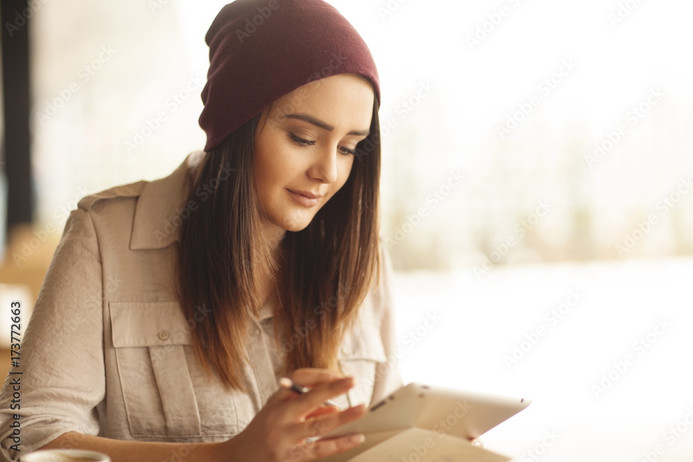 young woman reading news on her tablet young woman reading news on her tablet