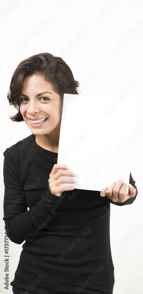 Beautiful young woman holding a blank sheet of paper Beautiful young woman holding a blank sheet of paper