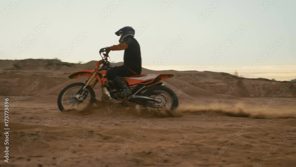 Professional Biker Rides on the FMX Motorcycle. He's on the Off-Road Dirt Track. Shot on RED EPIC-W 8K Helium Cinema Camera. Professional Biker Rides on the FMX Motorcycle. He's on the Off-Road Dirt Track. Shot on RED EPIC-W 8K Helium Cinema Camera.