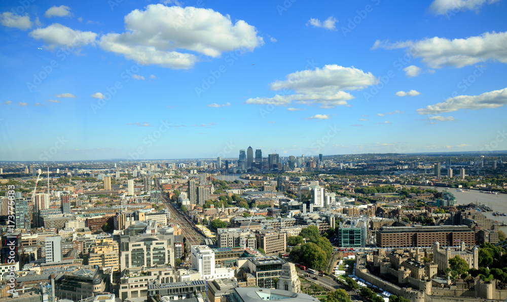 Aerial view looking after London on a summer day with nice blue fluffy clouds