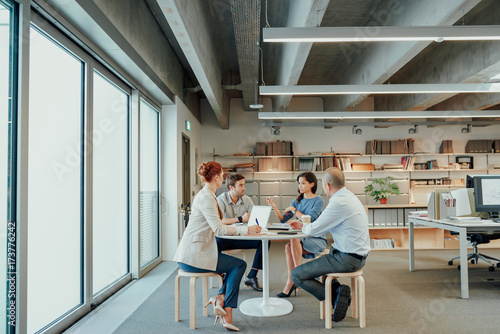 Informal business team meeting at lunch table