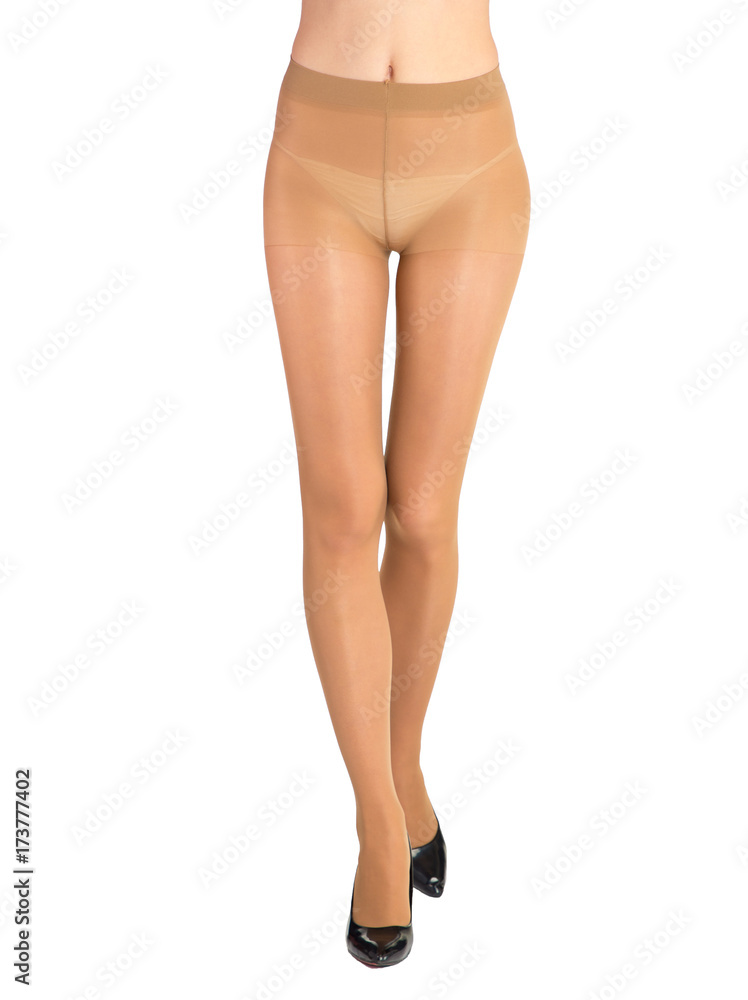 Shapely female legs dressed in tights body color Shapely female legs dressed in tights body color
