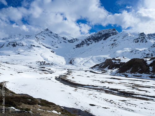 Pristine, snow mountains , swiss Alps, cloudless sky photo