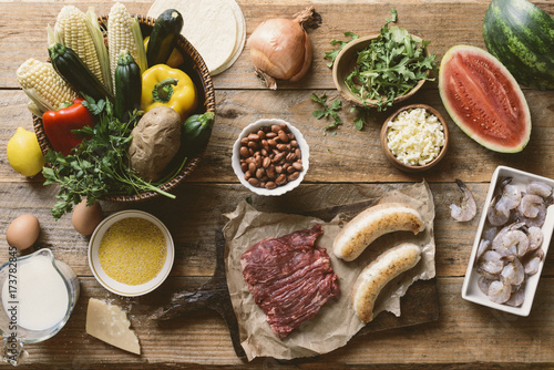 Nutritious organic proteins and fresh ingredients on wooden table