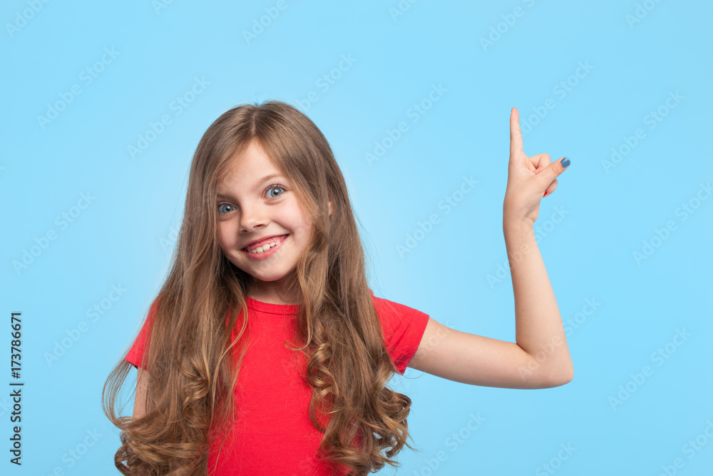 Excited little girl pointing up Excited little girl pointing up