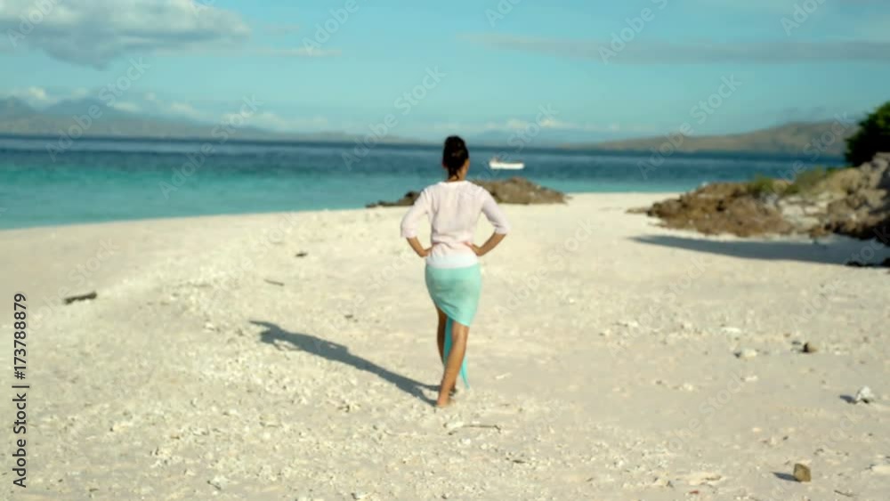 Attractive woman walking on the sandy beach, steadycam shot
Attractive woman walking on the sandy beach, steadycam shot