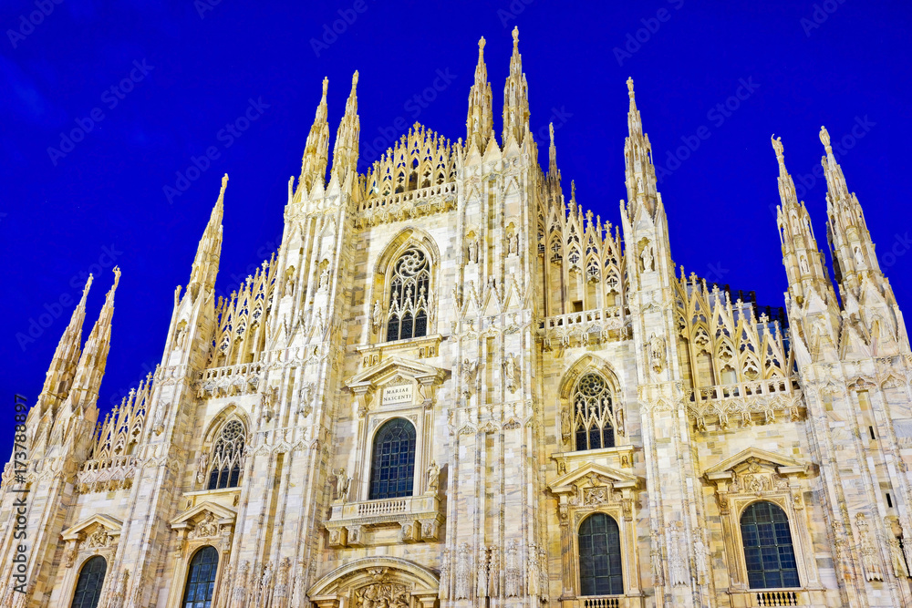 View of the Milan Cathedral at night in Milan, Italy.