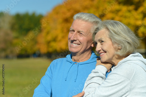  caucasian senior couple in the park