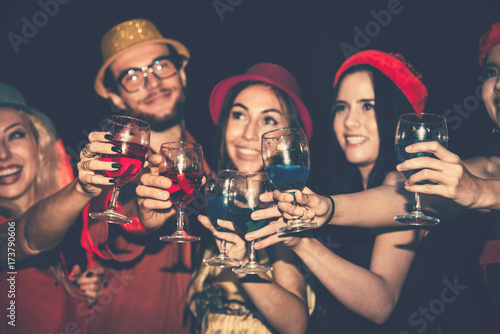 Cheerful Party of Friends are Enjoy and Clinking Cocktail Glass