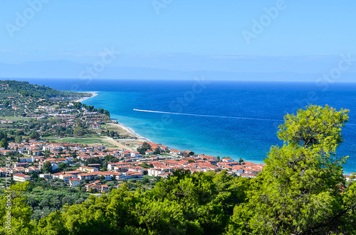 Beautiful European town panorama. Threes, sea and beach is displayed in the background. © Dijana