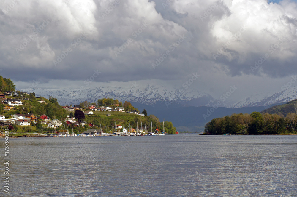 View on the town with a snowy mountian in distant weather during the stormy weather