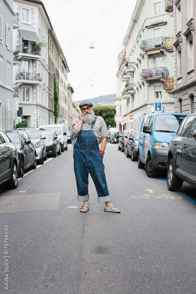 Street Style - Outdoor Portrait of Fashionable Older Man Wearing Denim Flap Trousers Street Style - Outdoor Portrait of Fashionable Older Man Wearing Denim Flap Trousers