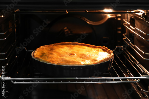 Delicious meat pie in oven