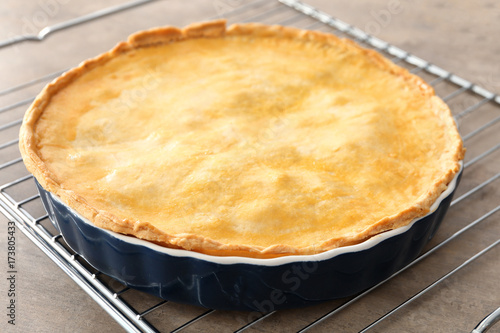 Delicious meat pie on baking grid