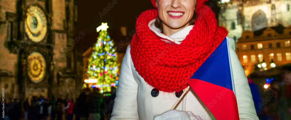 woman at Christmas in Prague Czech Republic with Czech flag