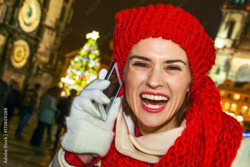 tourist woman at Christmas in Prague speaking on smartphone tourist woman at Christmas in Prague speaking on smartphone