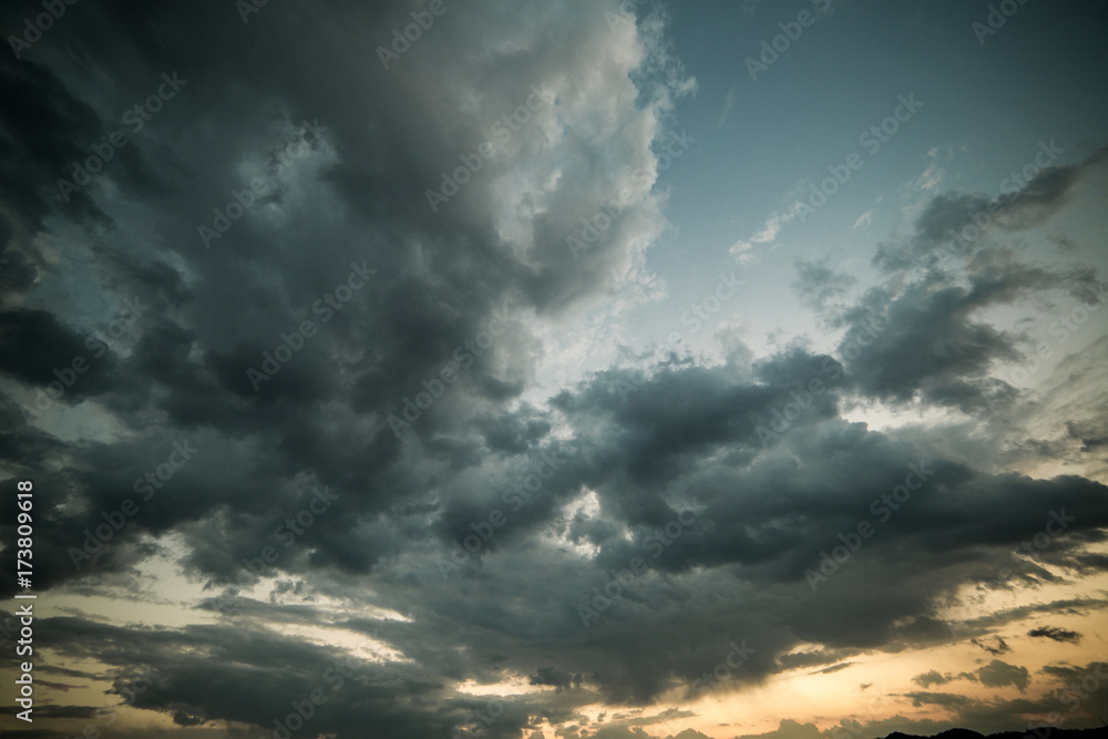 Blue/Gray/Orange sky overlay background with dramatic clouds at sunset