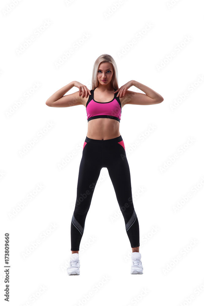 Woman stretching her arm to shoulder Woman stretching her arm to shoulder