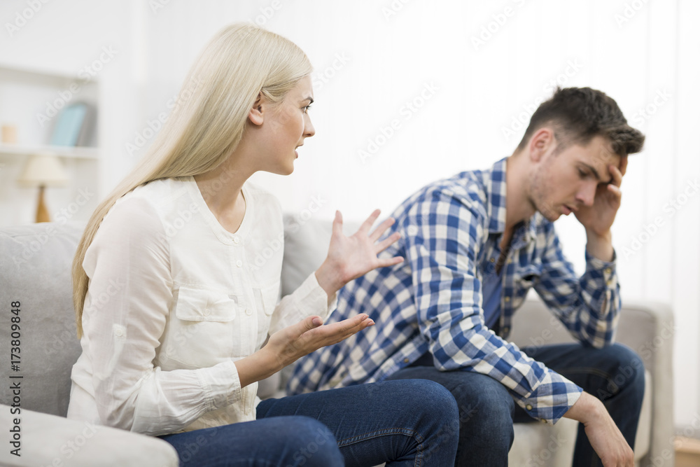 The man and woman quarreling on the sofa The man and woman quarreling on the sofa