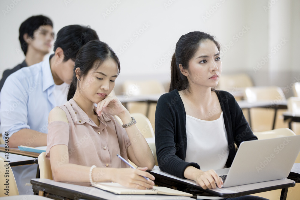 Asian People study together in classroom. People with Education concept. Asian People study together in classroom. People with Education concept.